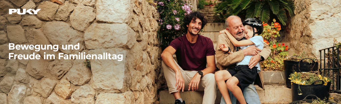 Puky Vater mit Kind und Fahrrad